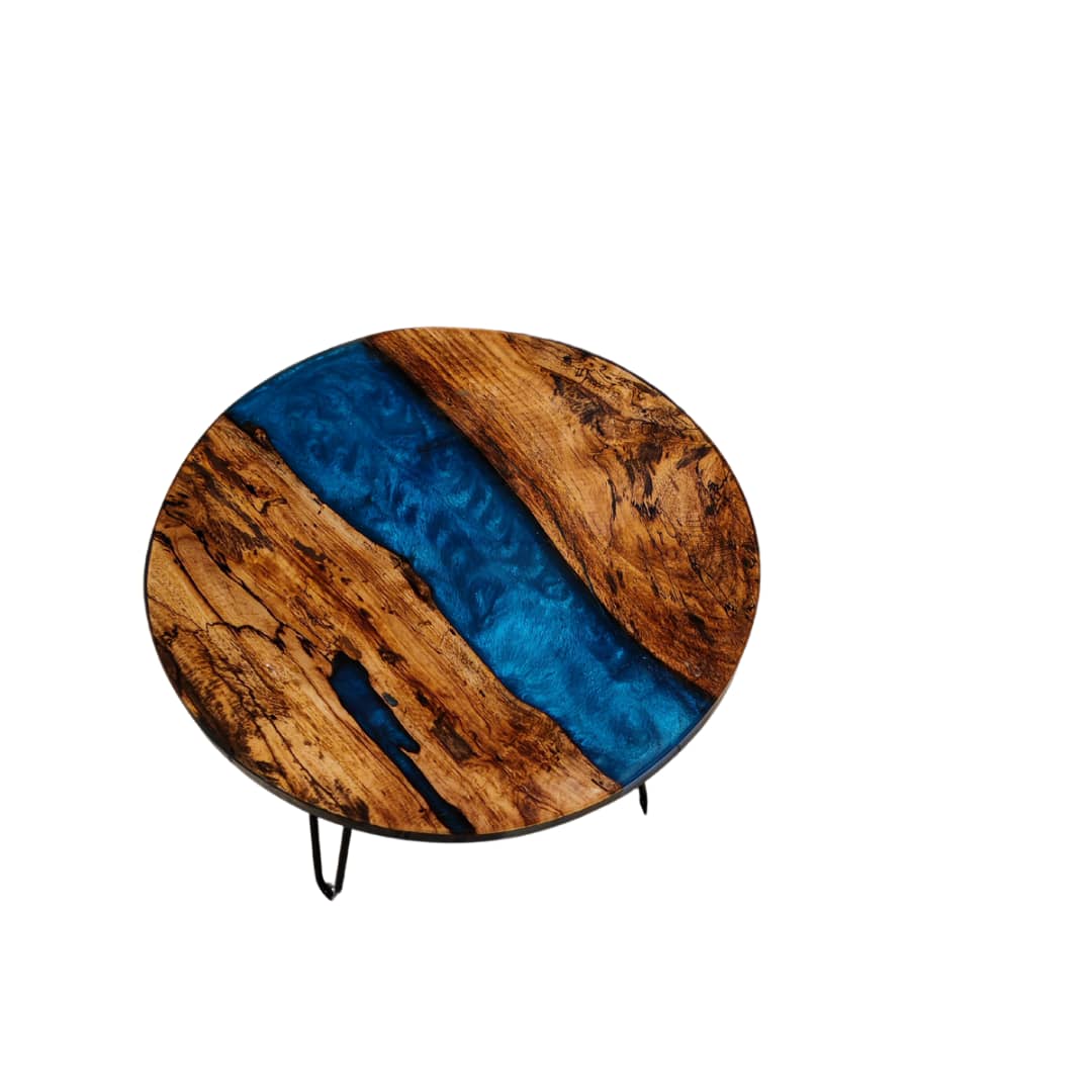 Natural wood and epoxy side table.  With blue inlay, 20 inches round with black pin legs